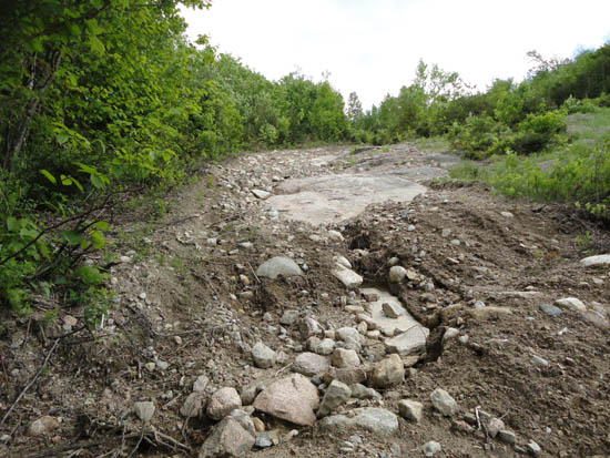 The eroded Mittersill access road, June 2011